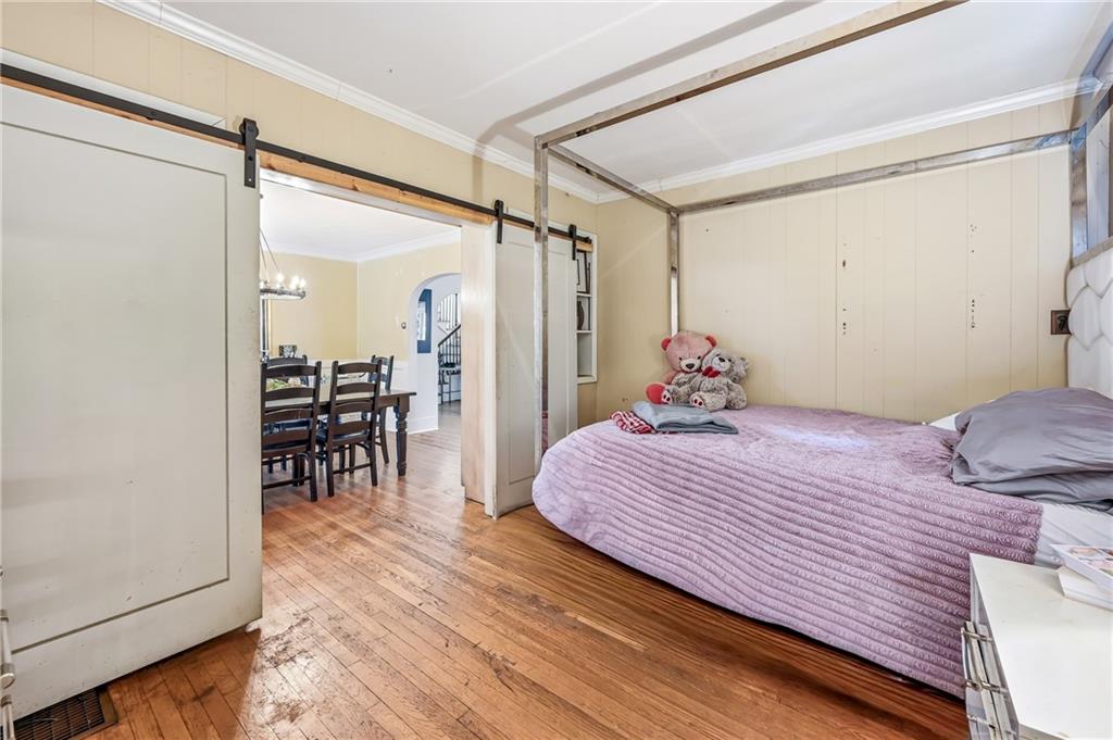 371 Case Avenue Sharon, PA 16146 - Photo 14 of 41 a bedroom with a bed and a chandelier