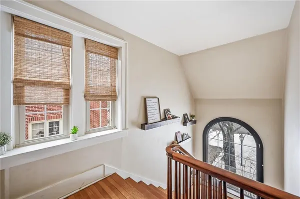a view of a hallway with a window