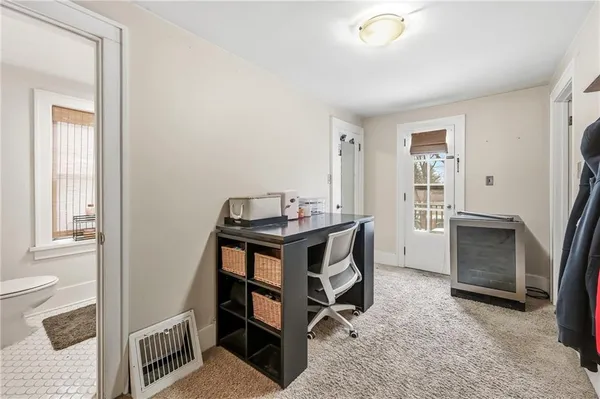 a room that has a bed and a table in it