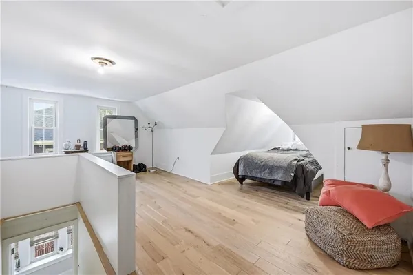 a bedroom with furniture and a window