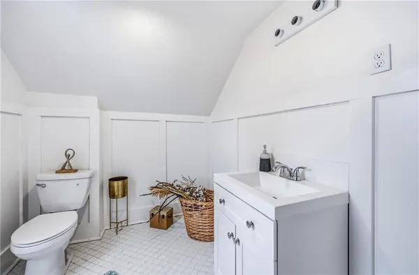 a bedroom with furniture and a flat screen tv