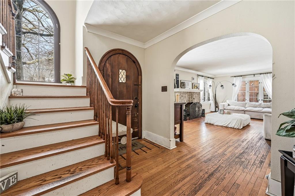 371 Case Avenue Sharon, PA 16146 - Photo 3 of 41 a living room with furniture a fireplace and a large window