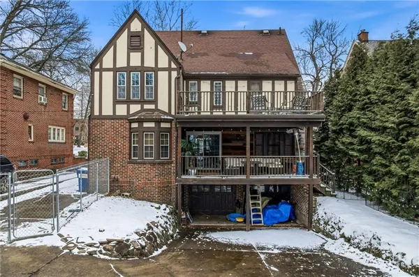 a view of a balcony with chairs