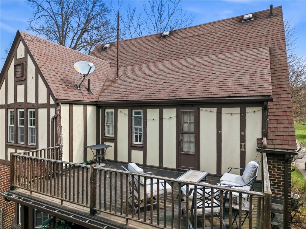 371 Case Avenue Sharon, PA 16146 - Photo 35 of 41 a view of a brick house with floor to ceiling windows and wooden fence