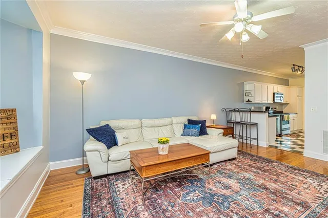 a bedroom with furniture and wooden floor