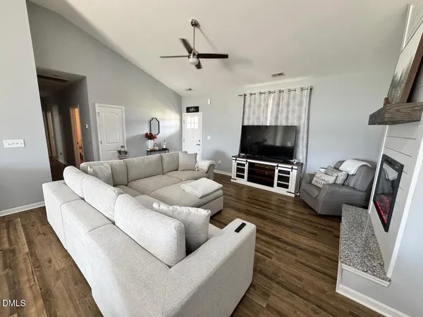 a living room with furniture and a flat screen tv