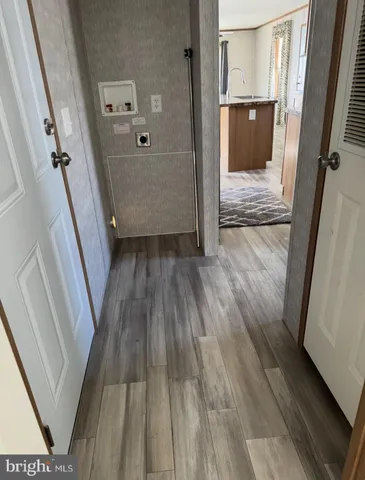 a view of front door with wooden floor