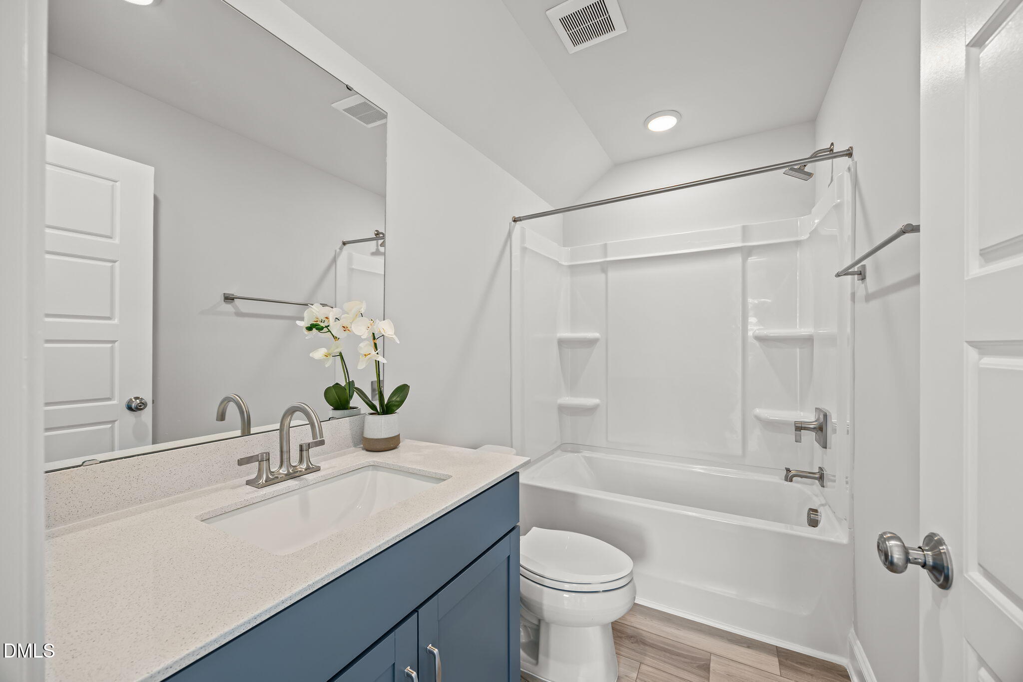 501 Hedrick Ridge Road Cary, NC 27519 - Photo 37 of 47 a bathroom with a sink toilet a mirror and shower