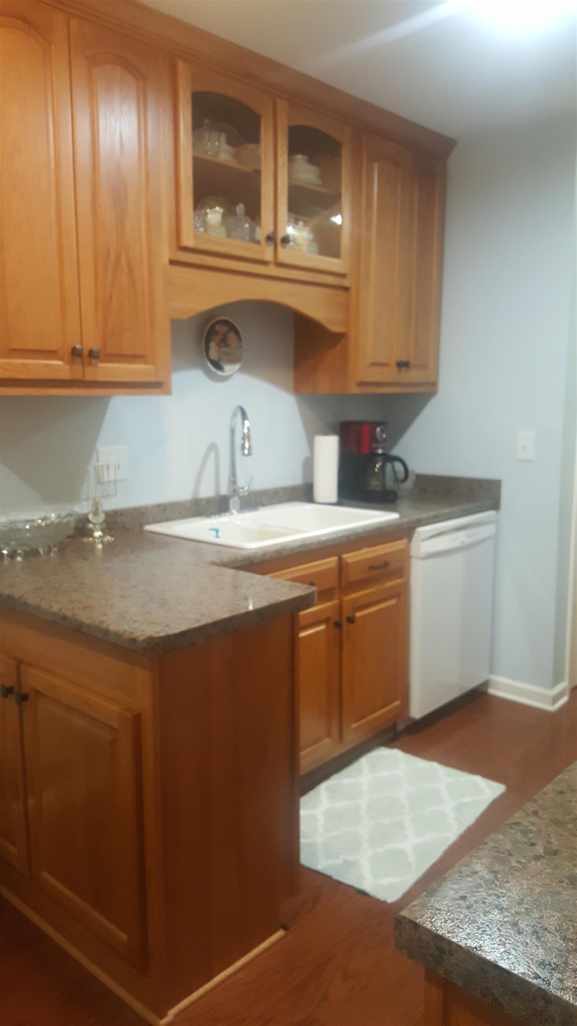 1055 General George Patton Road, Unit 1055 Nashville, TN 37221 - Photo 5 of 13 a kitchen with a sink cabinets and appliances
