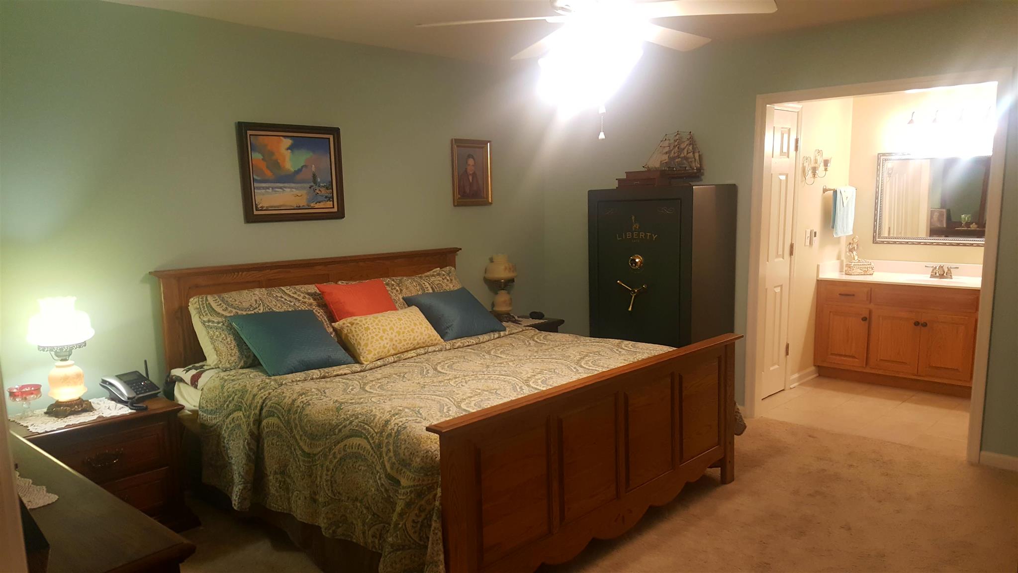 1055 General George Patton Road, Unit 1055 Nashville, TN 37221 - Photo 7 of 13 a bedroom with a bed and a table