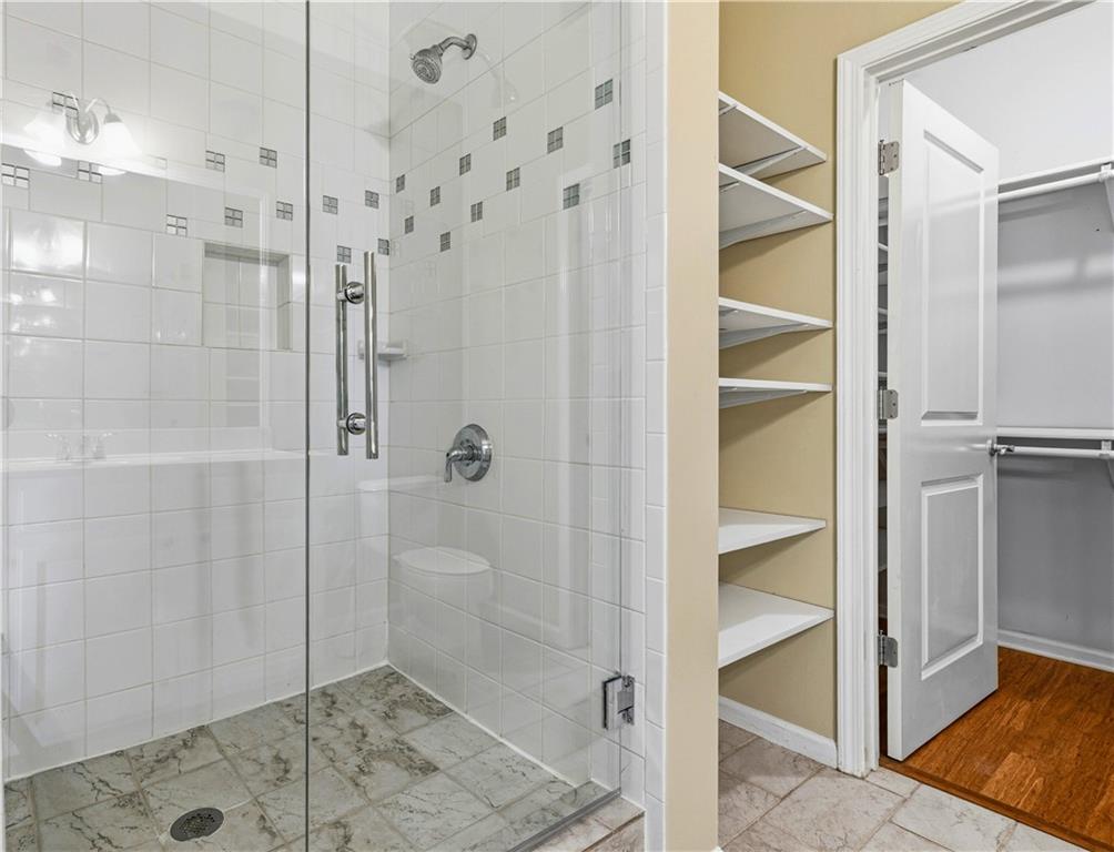 3040 Peachtree Road Northwest, Unit 1503 Atlanta, GA 30305 - Photo 17 of 38 a bathroom with a shower