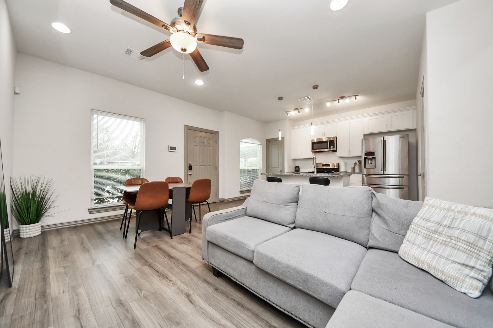 5334 Pershing Street Houston, TX 77033 - Photo 23 of 43 a living room with furniture kitchen view and a large window