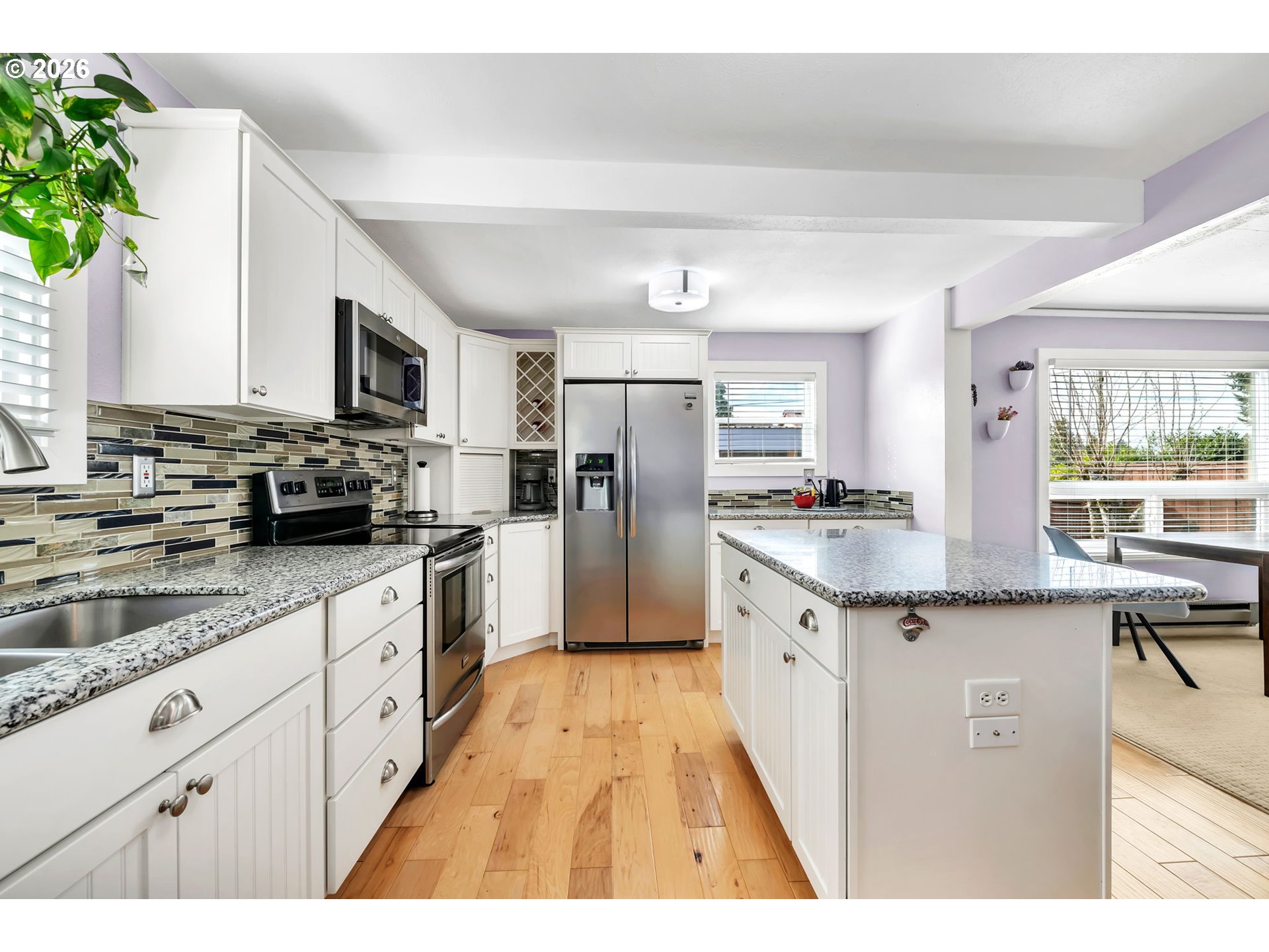 157 Hansen Lane Eugene, OR 97404 - Photo 11 of 46 a kitchen with granite countertop a sink appliances cabinets and counter space