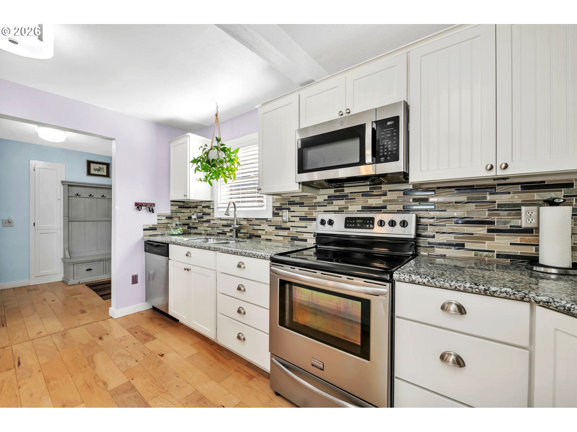 157 Hansen Lane Eugene, OR 97404 - Photo 12 of 46 a kitchen with stainless steel appliances granite countertop a stove a sink and a microwave