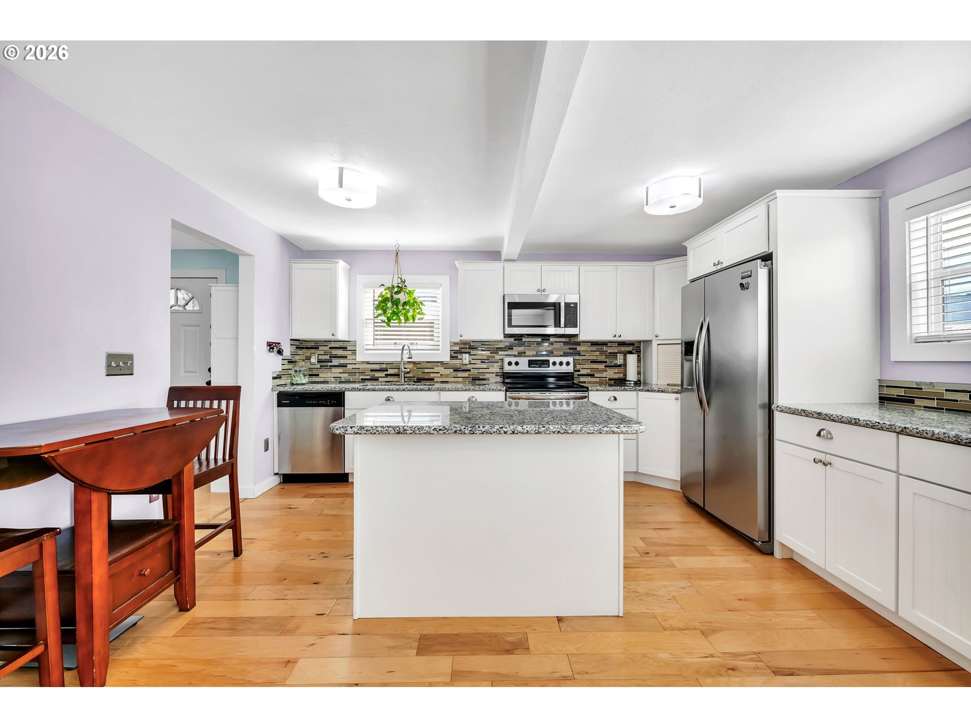 157 Hansen Lane Eugene, OR 97404 - Photo 13 of 46 a kitchen with stainless steel appliances granite countertop a refrigerator a stove a sink a dining table and chairs
