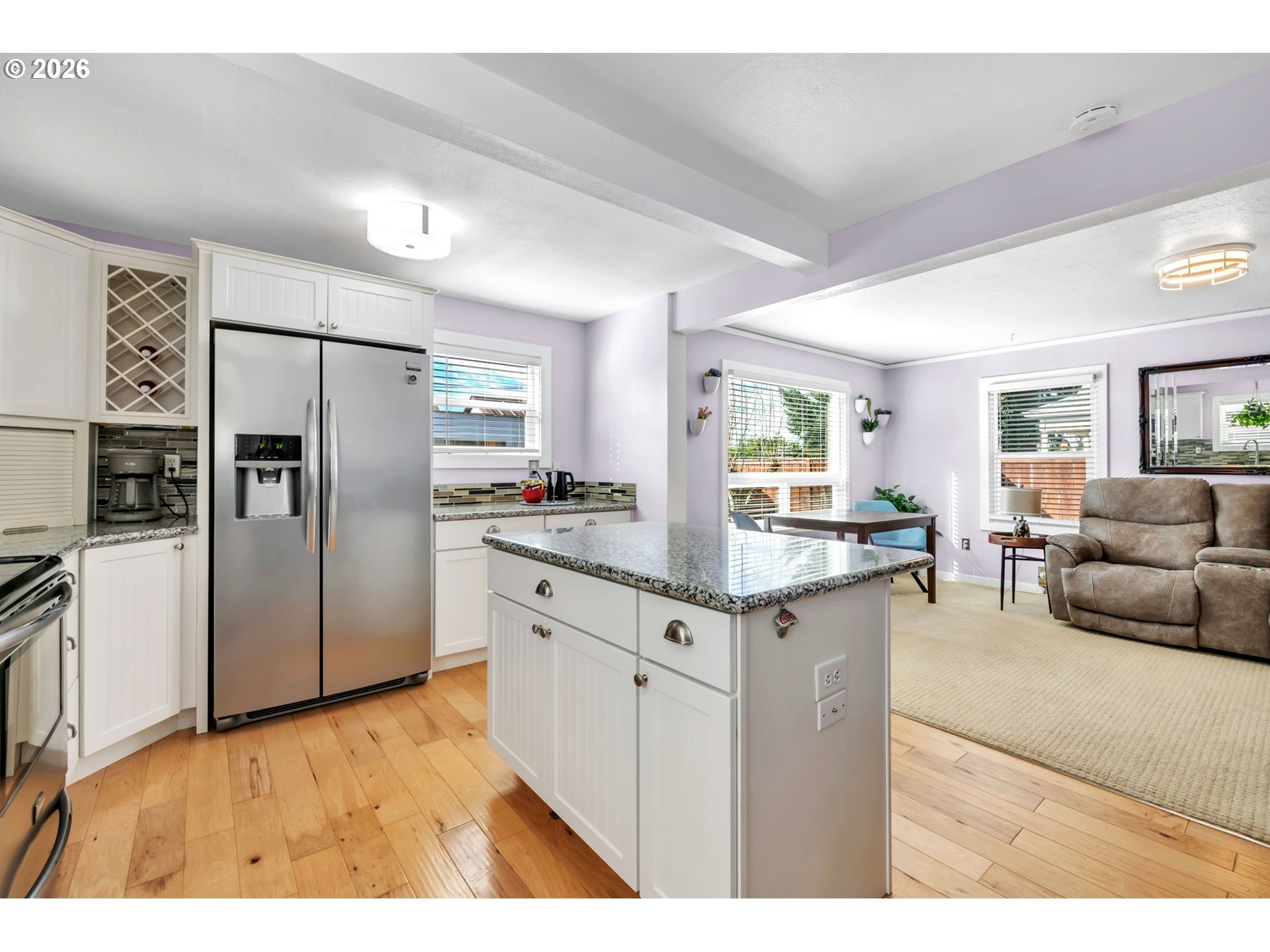 157 Hansen Lane Eugene, OR 97404 - Photo 16 of 46 a kitchen with granite countertop a refrigerator and furniture