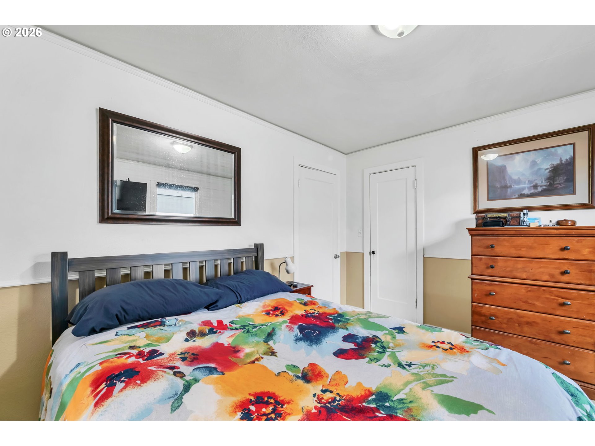 157 Hansen Lane Eugene, OR 97404 - Photo 29 of 46 a bedroom with a bed and a painting on the wall