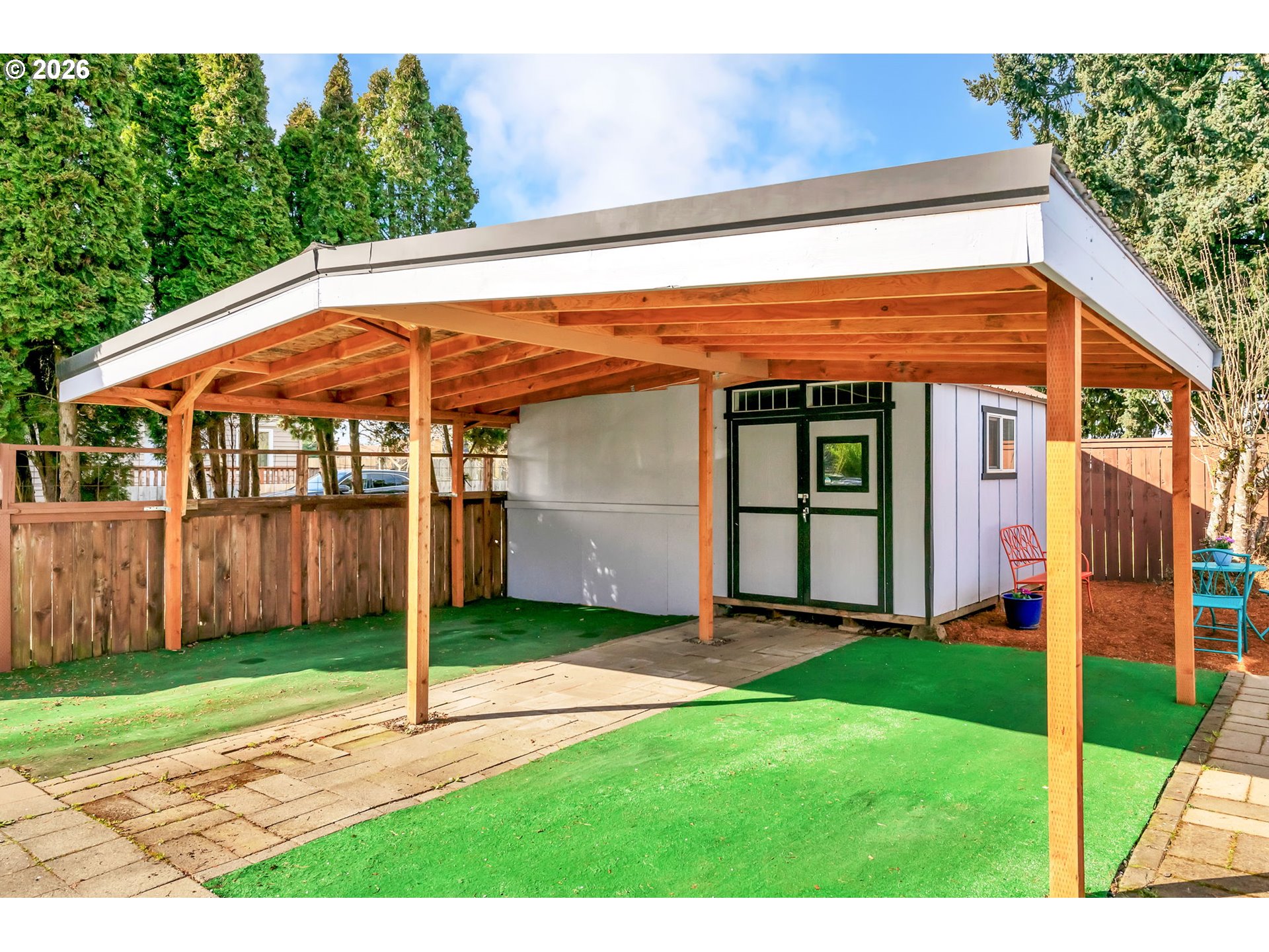 157 Hansen Lane Eugene, OR 97404 - Photo 36 of 46 a view of a backyard with a barbeque grill and a small yard
