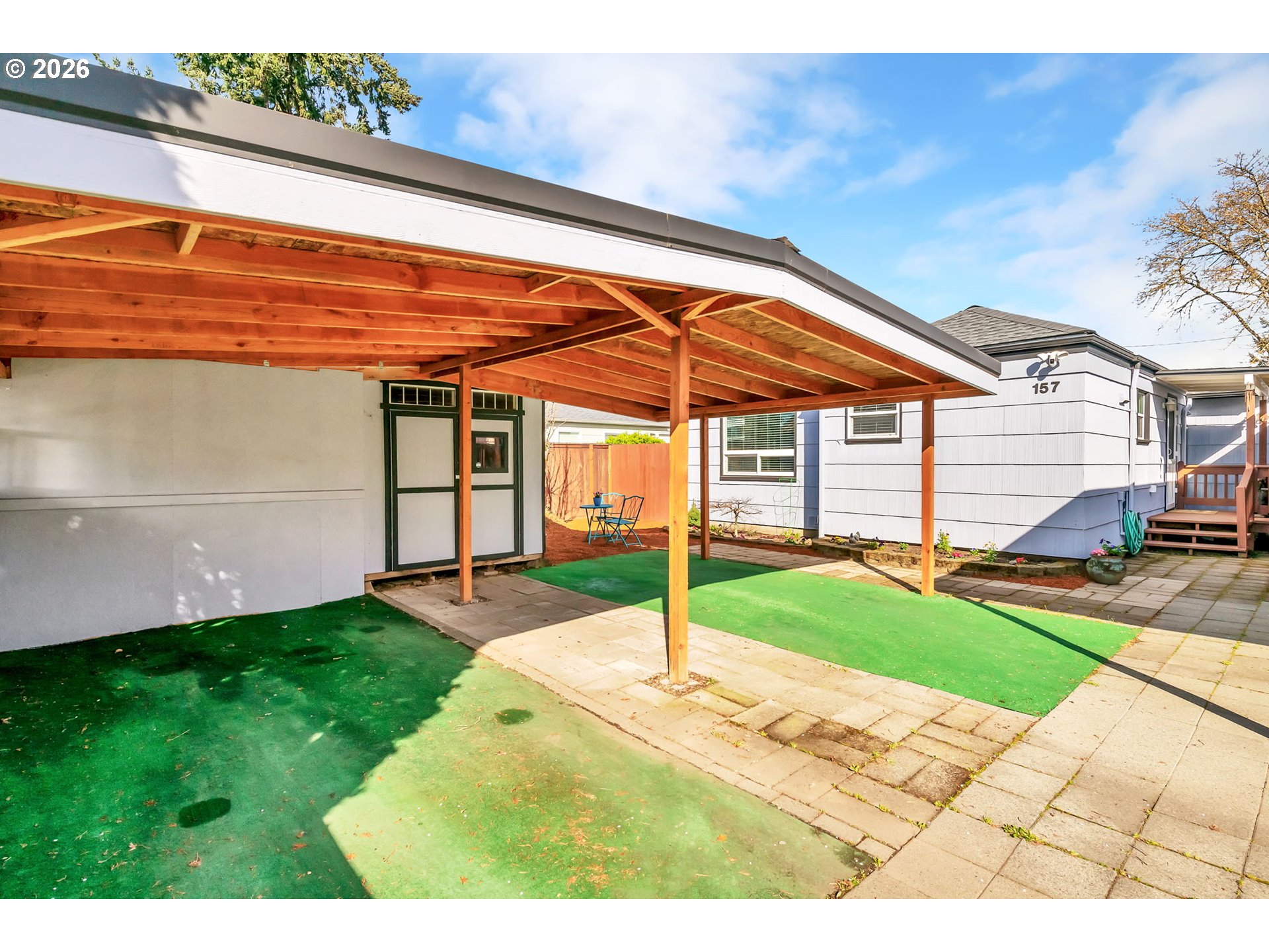 157 Hansen Lane Eugene, OR 97404 - Photo 5 of 46 a backyard of a house with yard and outdoor seating