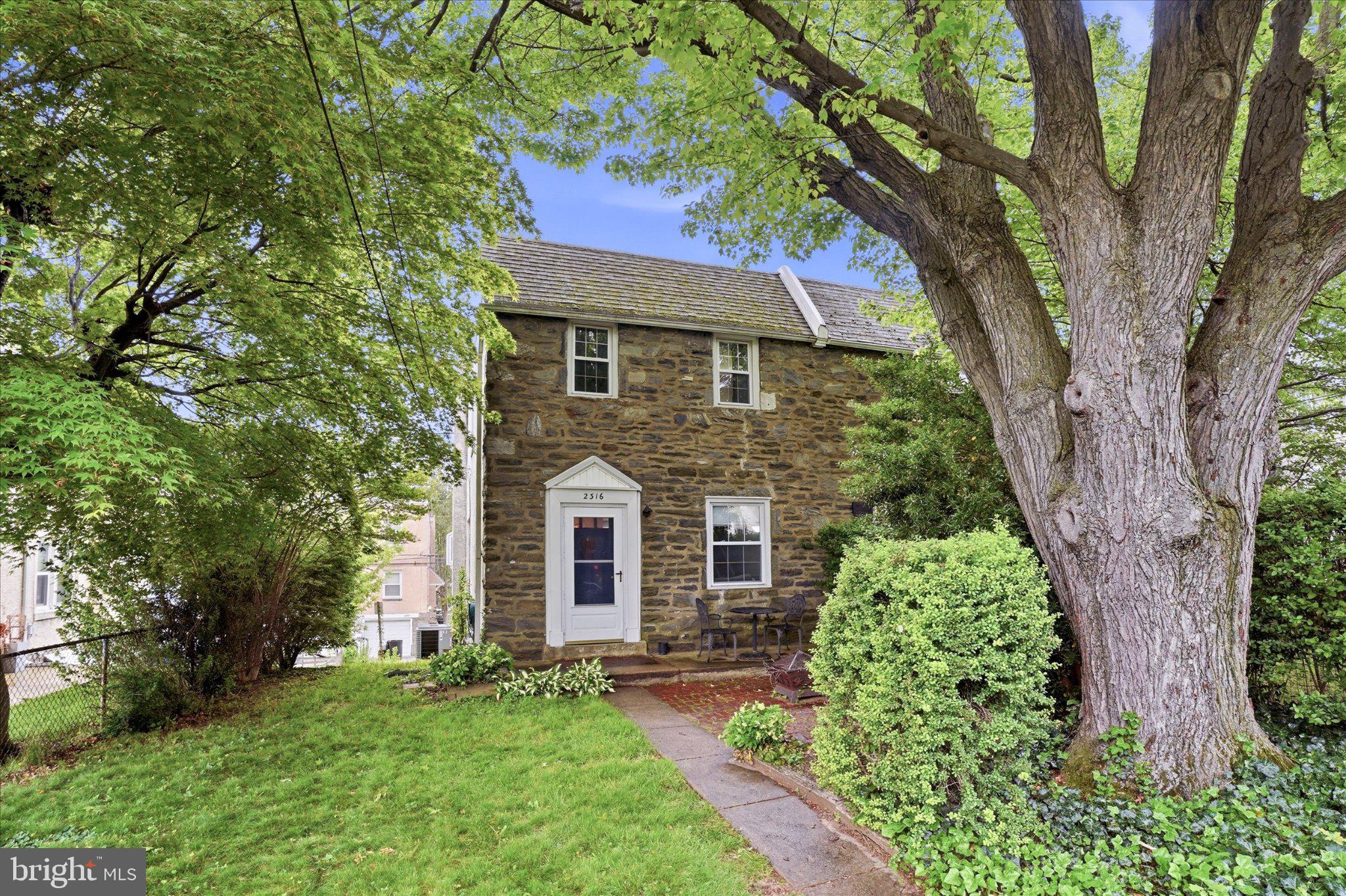 2316 Kenilworth Road Ardmore, PA 19003 - Photo 1 of 25 Charming stone home under lush trees.