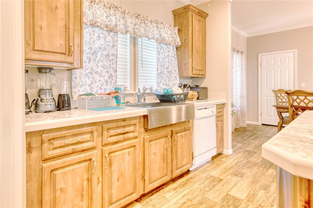 274 Northeast 106th Street Okeechobee, FL 34972 - Photo 12 of 43 a kitchen with stainless steel appliances granite countertop a sink and cabinets