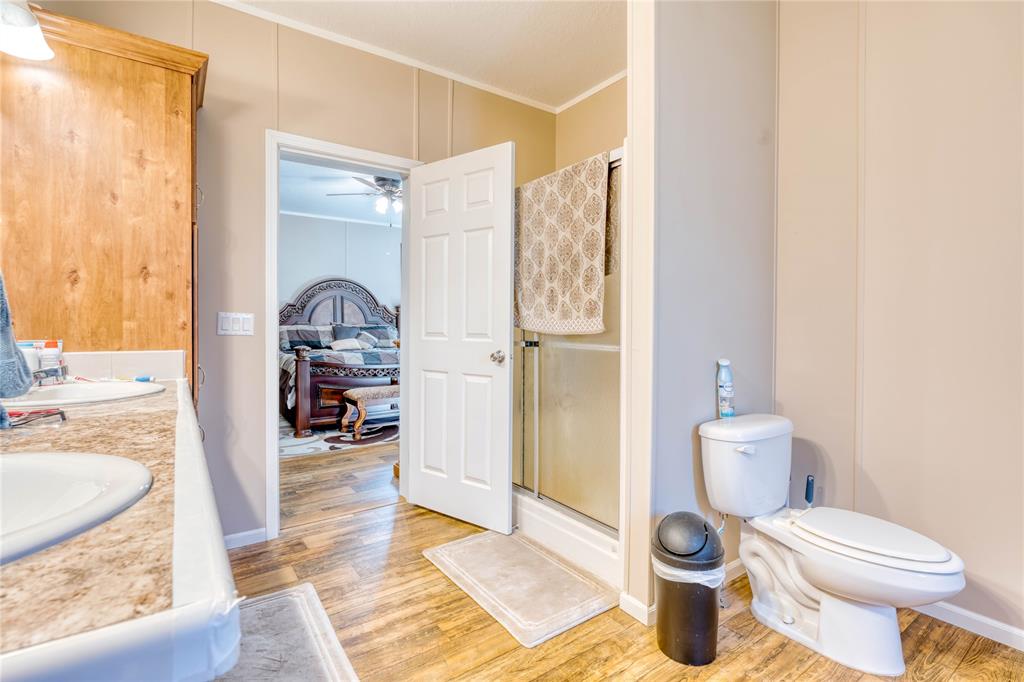 274 Northeast 106th Street Okeechobee, FL 34972 - Photo 24 of 43 a bathroom with a toilet sink and shower