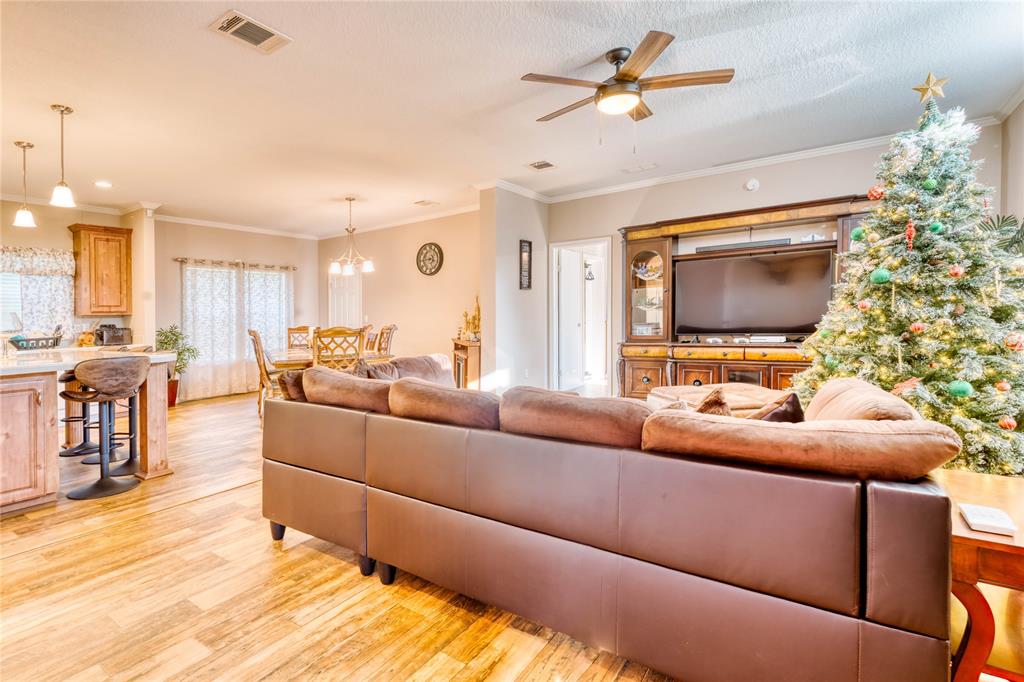 274 Northeast 106th Street Okeechobee, FL 34972 - Photo 3 of 43 a living room with furniture and a flat screen tv
