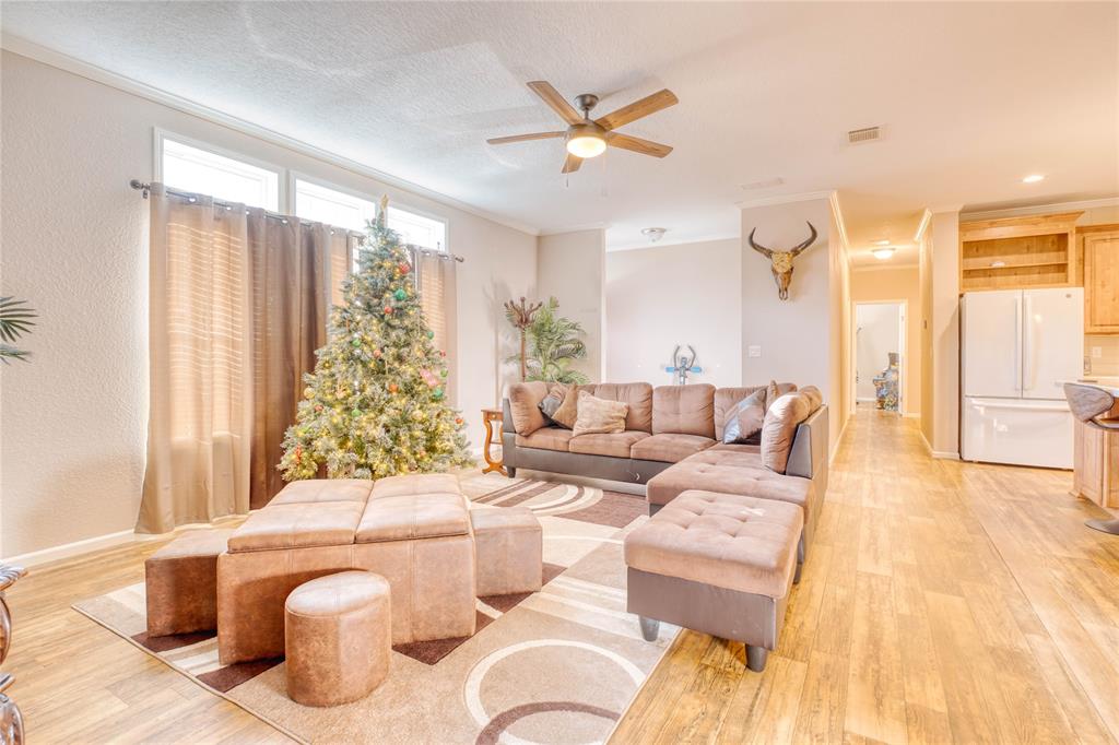 274 Northeast 106th Street Okeechobee, FL 34972 - Photo 4 of 43 a living room with furniture and a large window