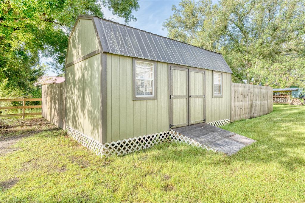 274 Northeast 106th Street Okeechobee, FL 34972 - Photo 43 of 43 a view of a backyard with a garden