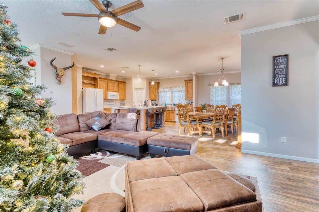 274 Northeast 106th Street Okeechobee, FL 34972 - Photo 5 of 43 a living room with furniture kitchen view and a potted plant