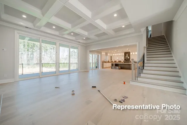 a view of kitchen with kitchen island and stainless steel appliances
