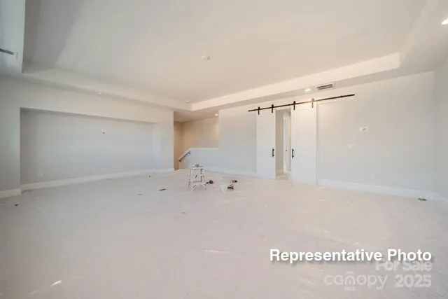 a view of a bedroom with a bed