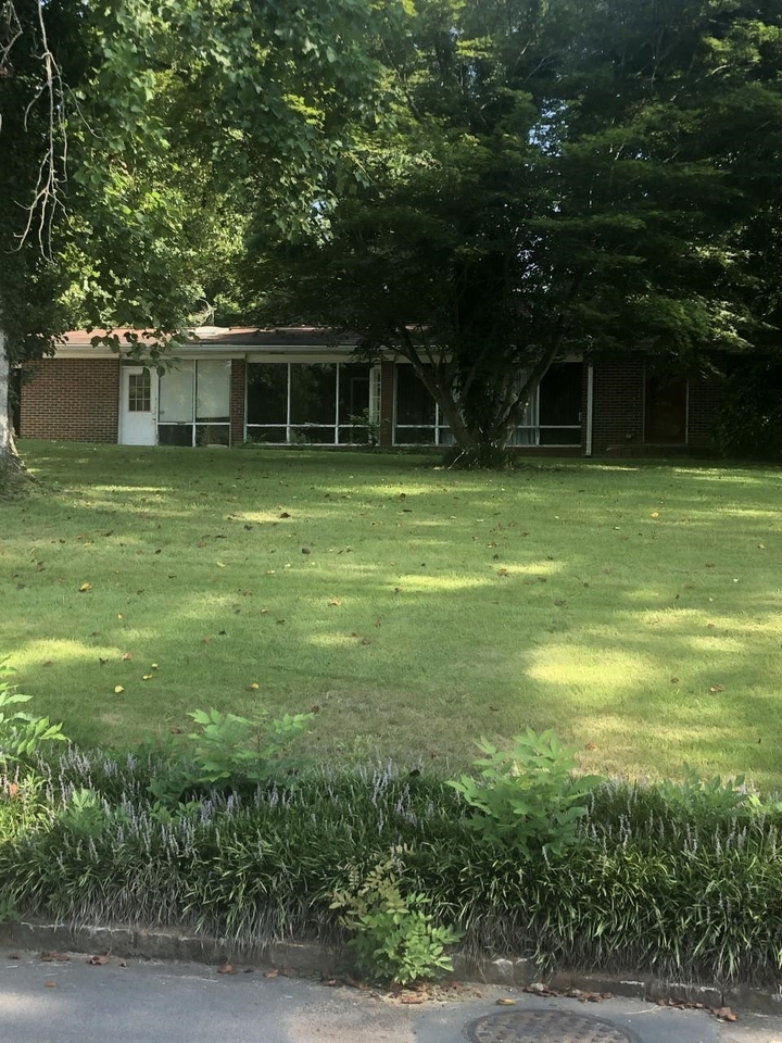 2056 Garden Circle Decatur, GA 30032 - Photo 1 of 1 a front view of a house with a garden
