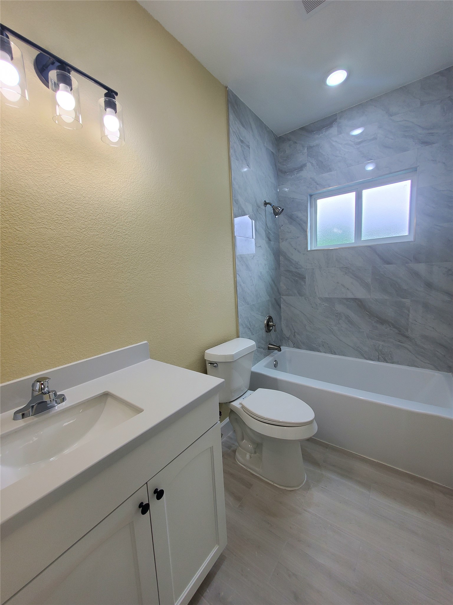 1306 North 9th Street Conroe, TX 77301 - Photo 43 of 47 a bathroom with a sink a toilet and shower