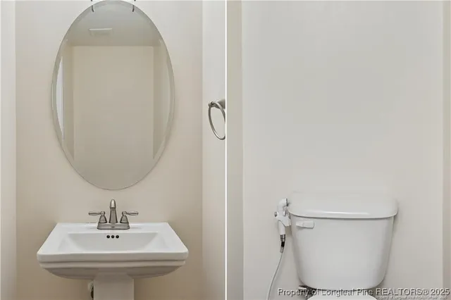 a bathroom with a toilet a sink and mirror