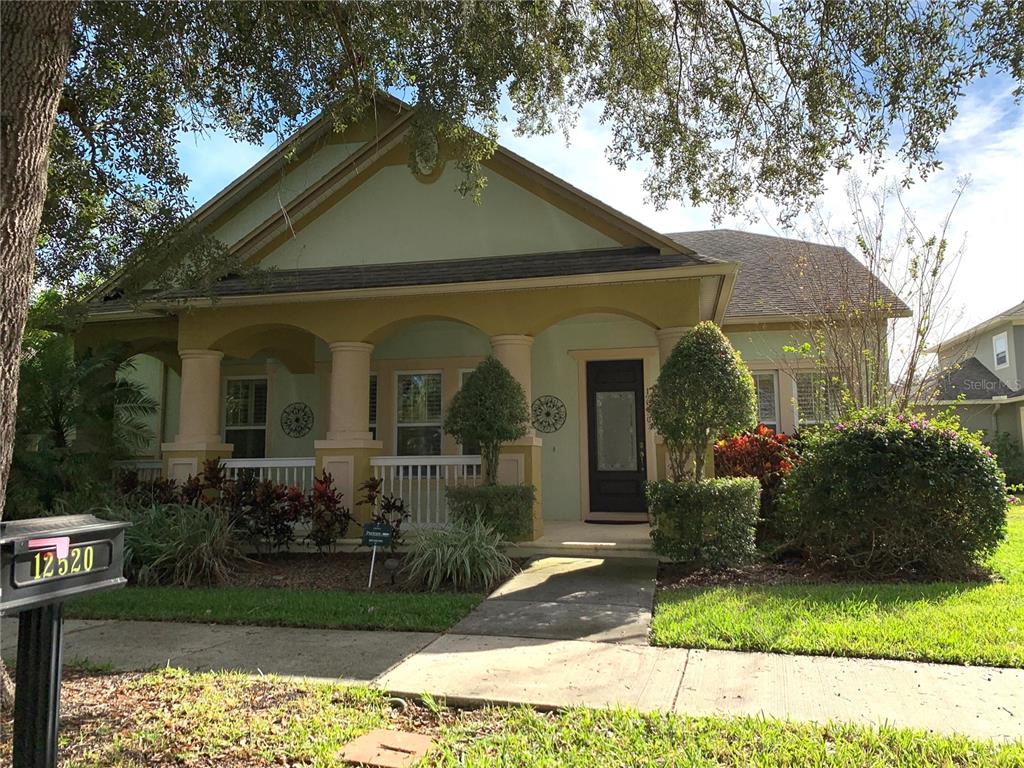 a front view of a house with garden