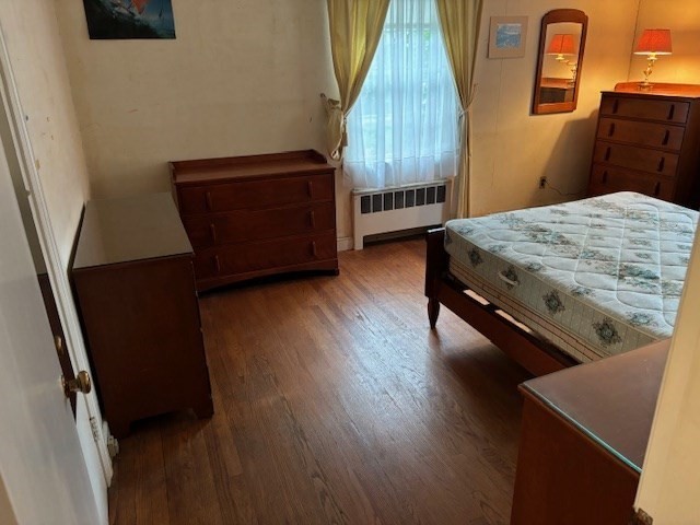 159 Florence Road Waltham, MA 02453 - Photo 6 of 12 a bedroom with a bed and a dresser