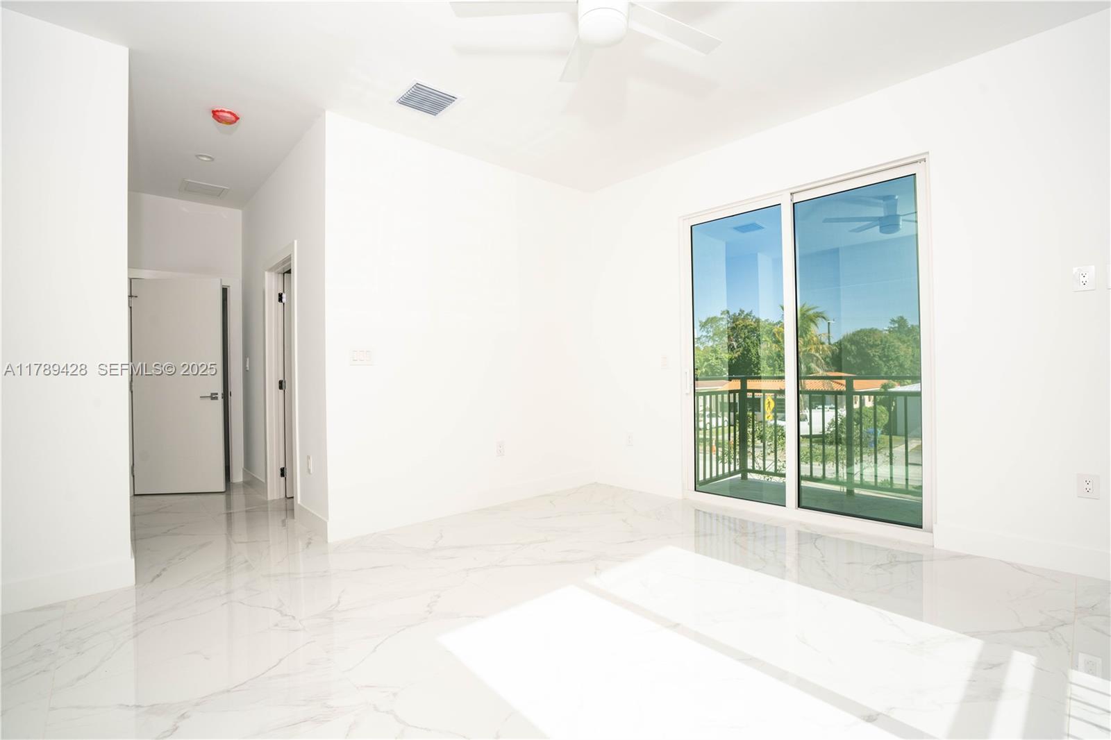 900 Southwest 24th Road Miami, FL 33129 - Photo 21 of 27 a view of an empty room with a window
