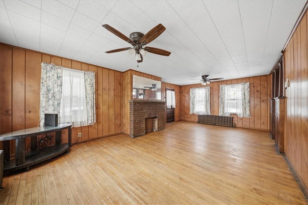 1060 Phillips Street Baden, PA 15005 - Photo 12 of 34 a view of an empty room with window and wooden floor