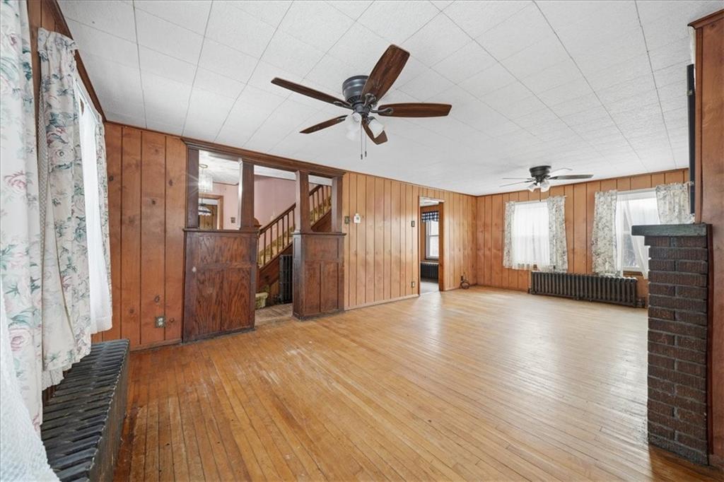 1060 Phillips Street Baden, PA 15005 - Photo 13 of 34 a view of a livingroom with a ceiling fan and window