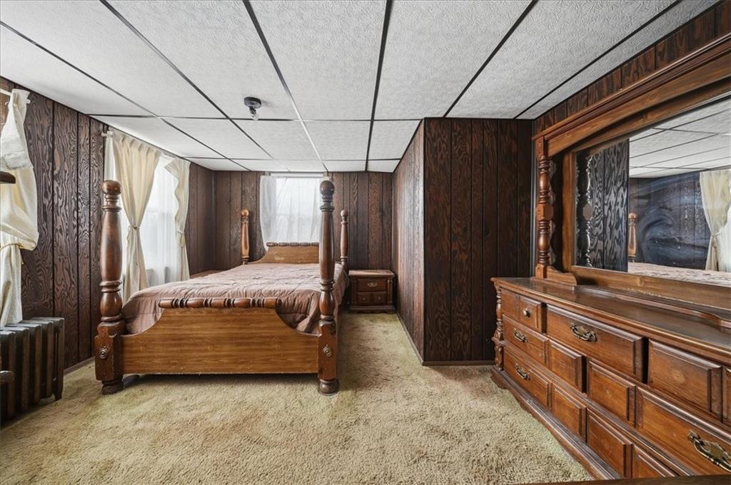 1060 Phillips Street Baden, PA 15005 - Photo 19 of 34 a bedroom with a bed and a large window