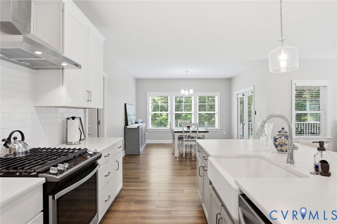 12040 Kenton Ridge Road Ashland, VA 23005 - Photo 12 of 54 Modern kitchen featuring white cabinetry, subway t
