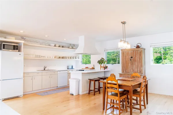 a open kitchen with a table and chairs in it