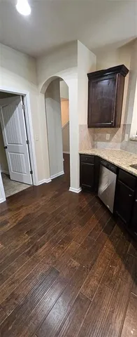 a living room with a flat screen tv and fireplace