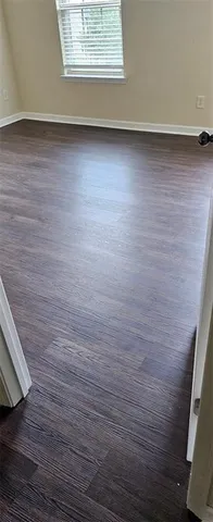 a view of a small space with wooden floor