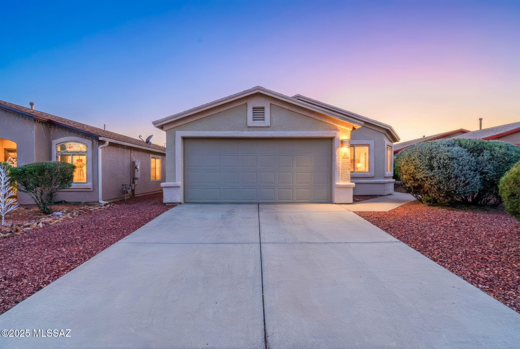 8244 South Lost Mountain Road Tucson, AZ 85747 - Photo 41 of 41 a view of a house with a yard and garage