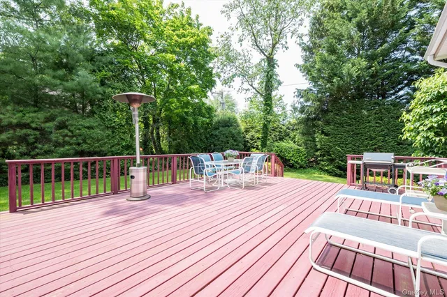 a view of a chairs on wooden deck