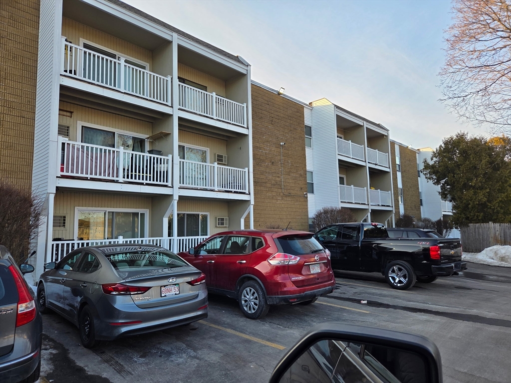 25 Ekman Street, Unit 13E Worcester, MA 01607 - Photo 1 of 10 a car parked in front of a house