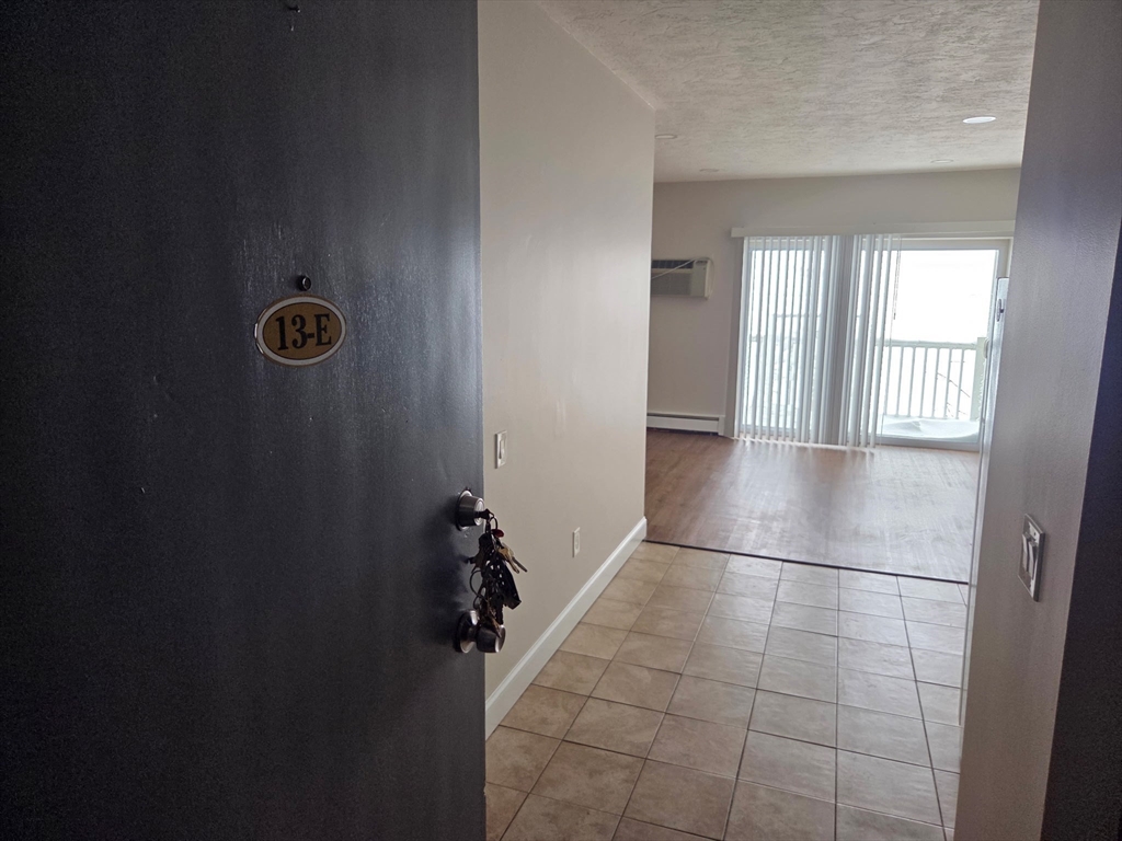 25 Ekman Street, Unit 13E Worcester, MA 01607 - Photo 2 of 10 a view of empty room with windows