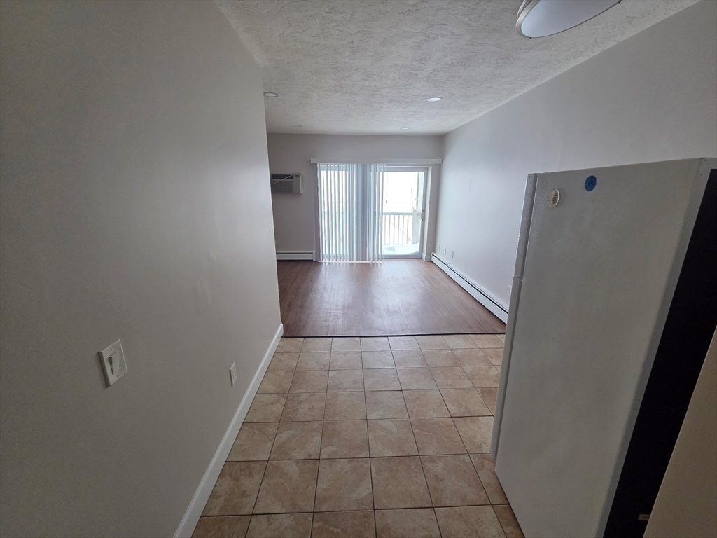 25 Ekman Street, Unit 13E Worcester, MA 01607 - Photo 3 of 10 a view of an empty room and window